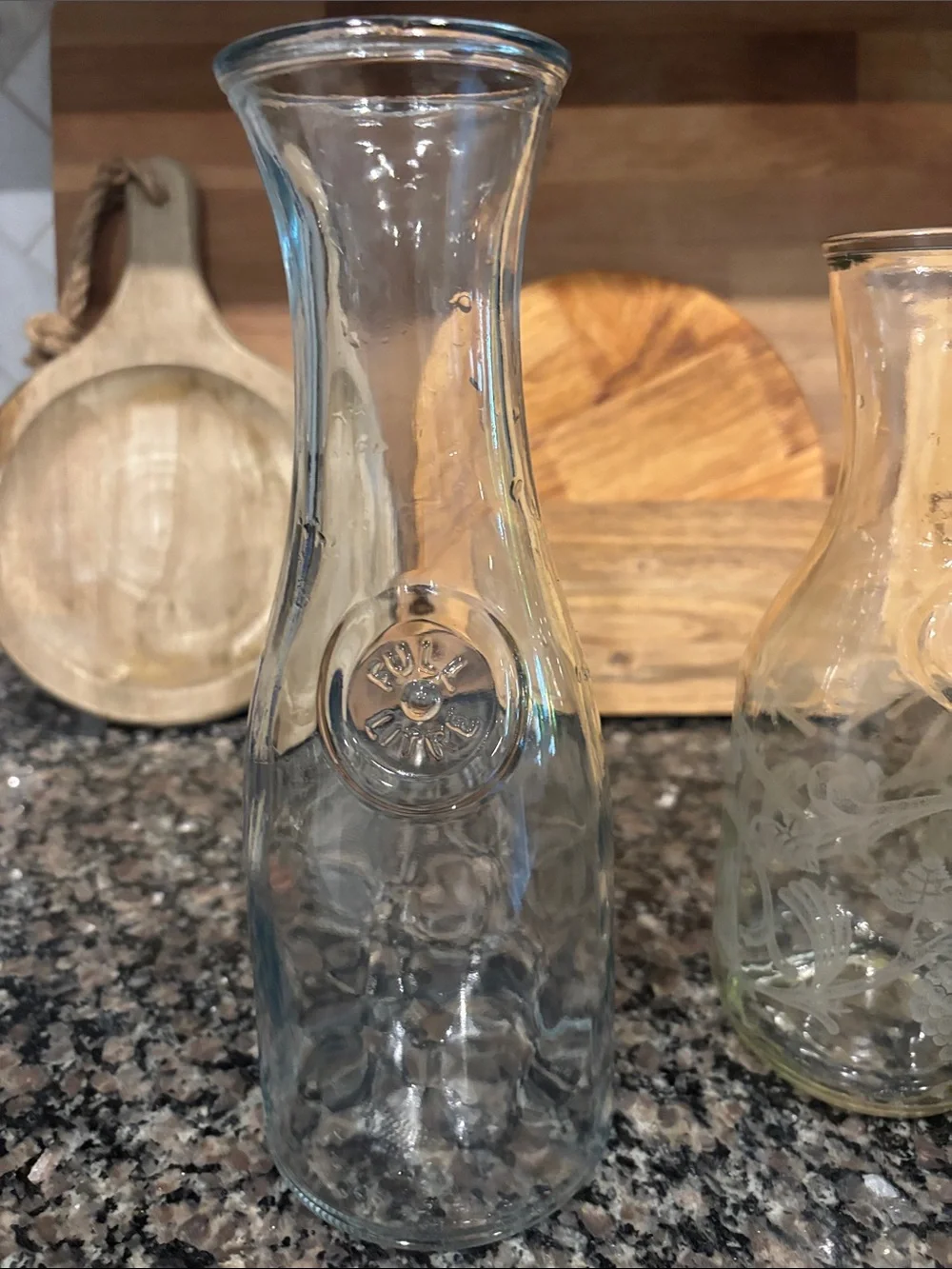 This is an Anchor Hocking 1-liter clear glass carafe, frequently used
